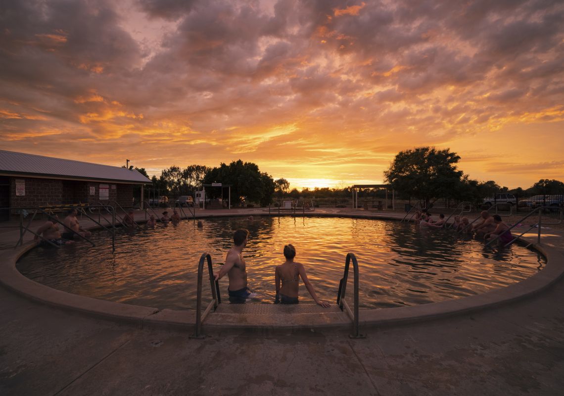Couple enjoying a visit to the Lightning Ridge Bore Baths in Lightning Ridge, Outback NSW