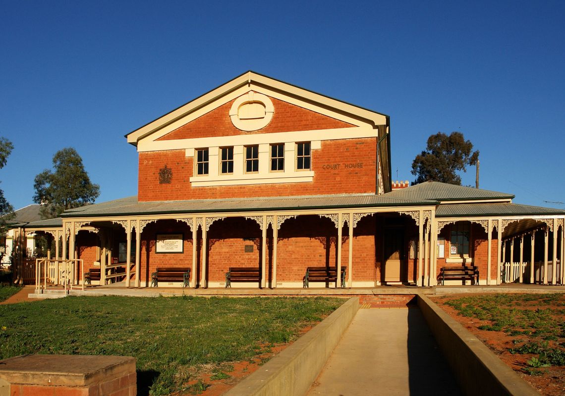 Two storey redbrick building Cobar's grand  court house, one of the last designed by the Colonial Architect in Cobar, Outback NSWarched verandah