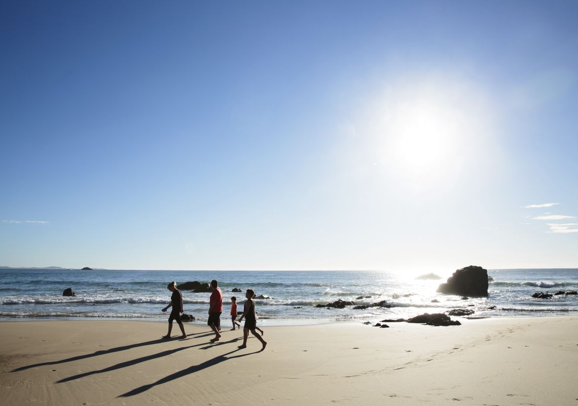 Family enjoying a morning walk on Flynns Beach, Port Macquarie on the North Coast