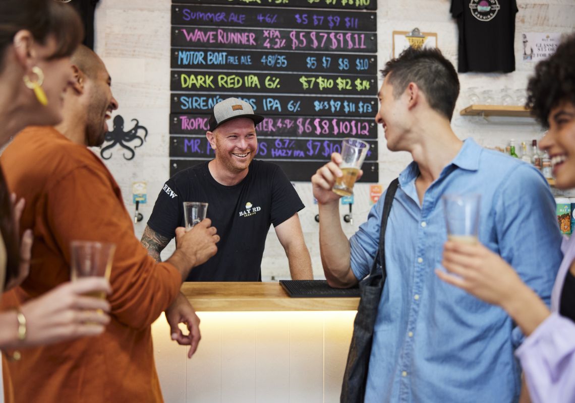 Friends enjoying a beer tasting experience at Bay Road Brewing, Gosford