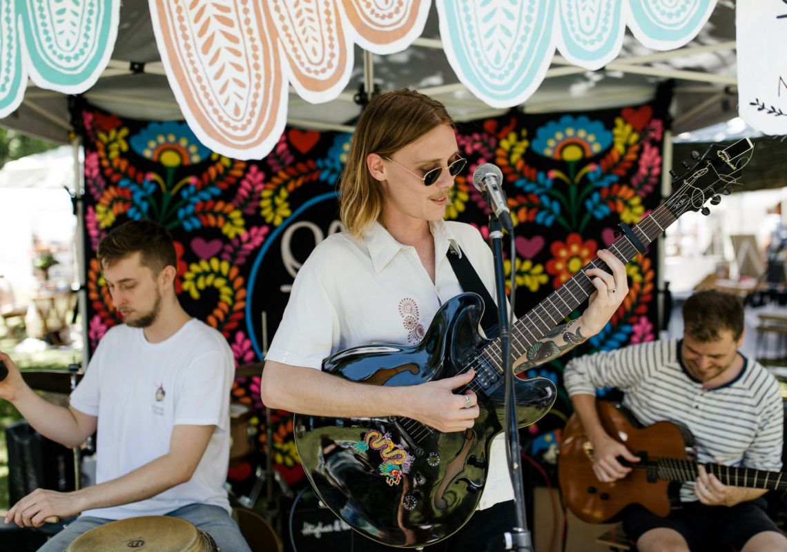 Relax to live music all day at The Olive Tree Market in Newcastle, North Coast