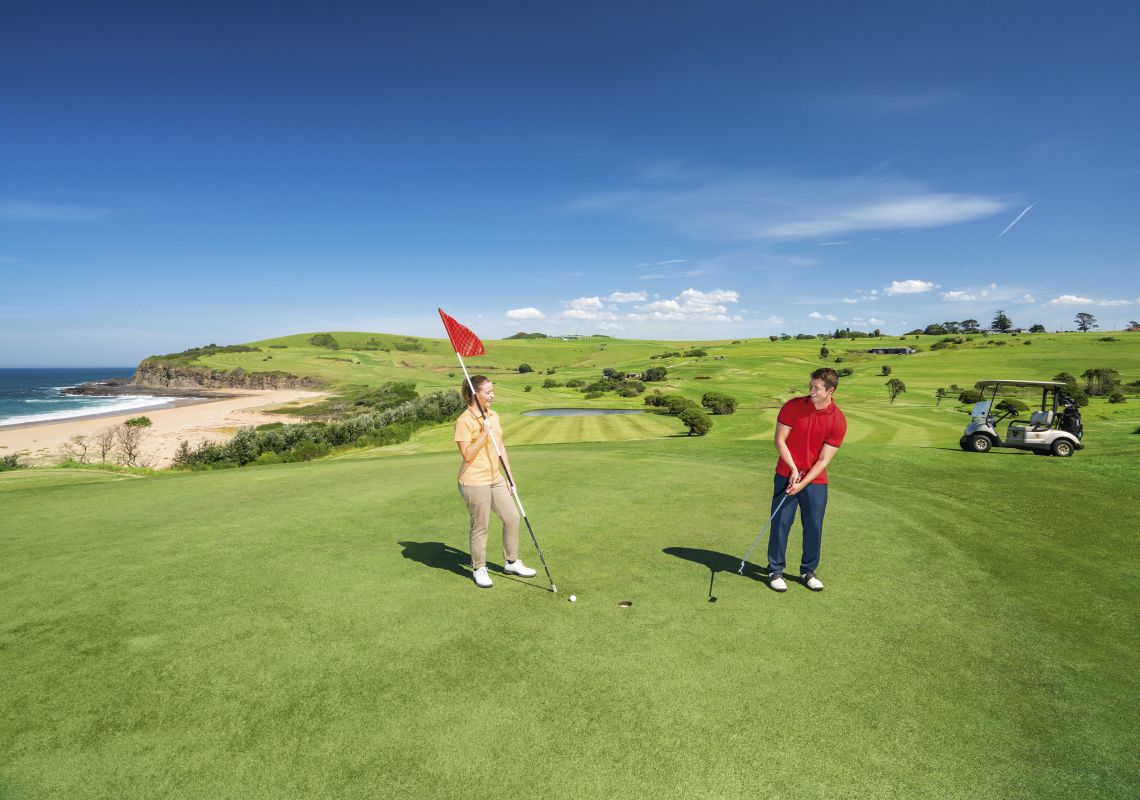 Couple enjoying a scenic round of golf at Kiama Golf Club on the South Coast