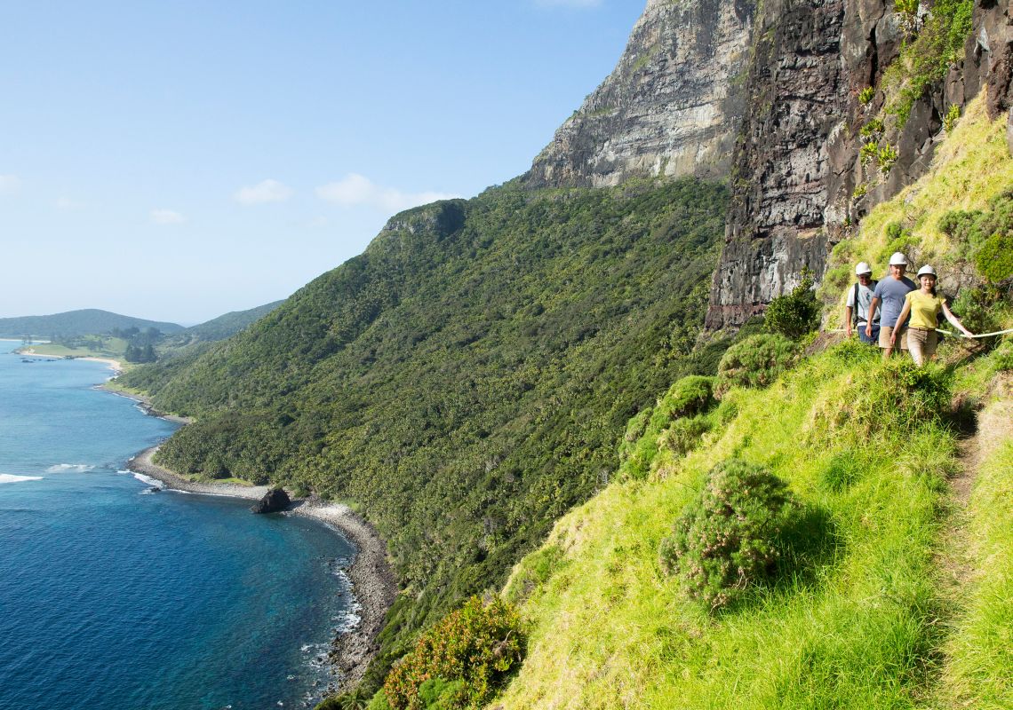 Couple enjoying a scenic hike up Mount Gower, Lord Howe Island