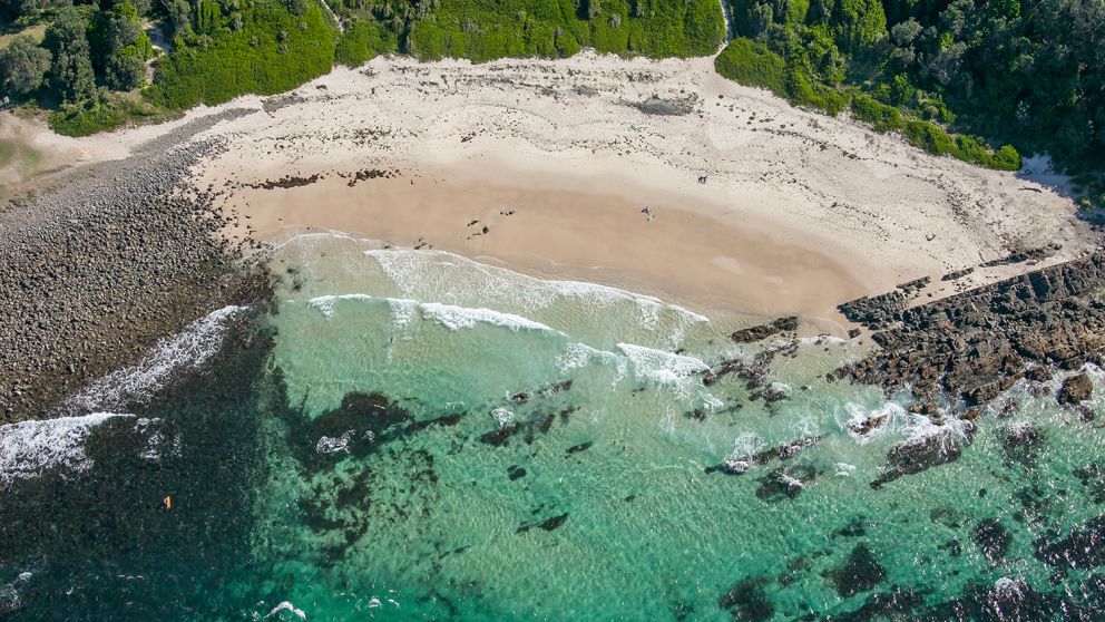 Coastal aerial of Pebbly Beach and Bicentennial Walk in Forster, North Coast NSW