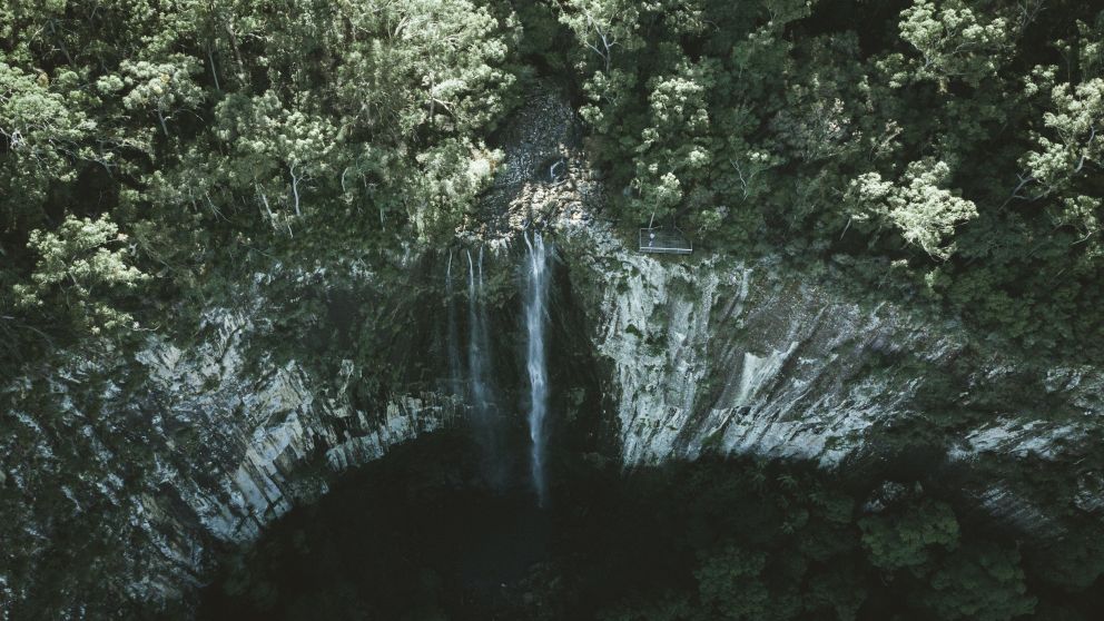 Aerial overlooking Minyon Falls in Nightcap National Park, Whian Whian, North Coast