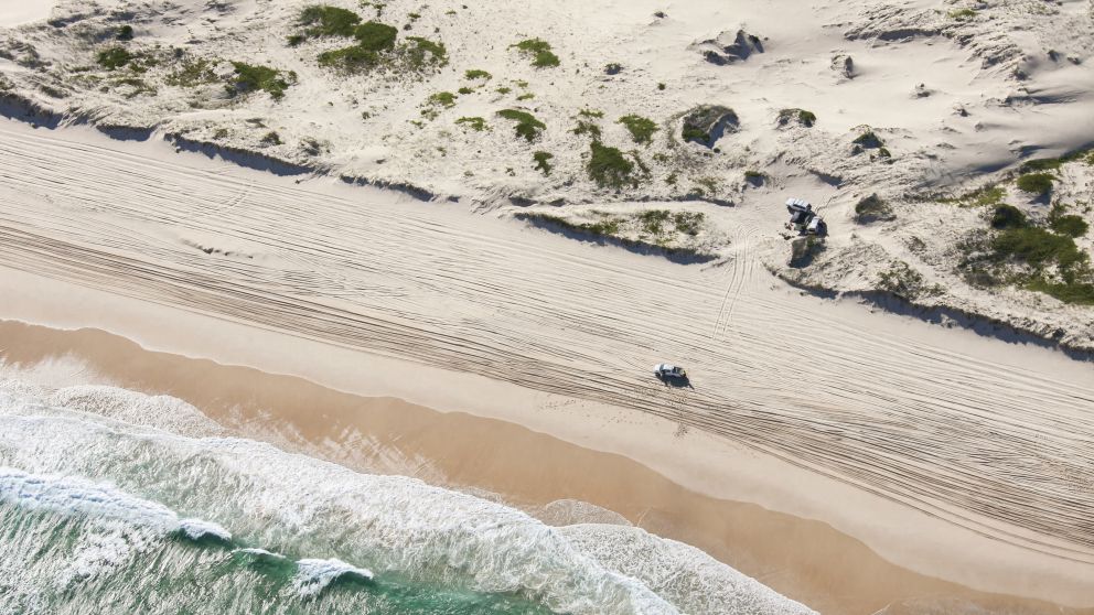 4WD driving along the beach on Worimi Conservation Lands - Port Stephens - North Coast