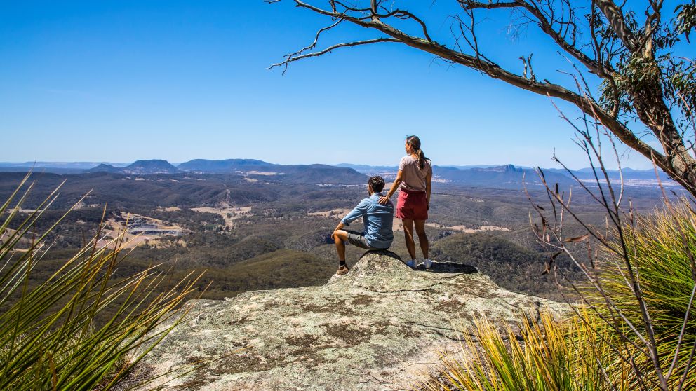 Couple enjoying scenic views across Capertee Valley in Capertee, Blue Mountains