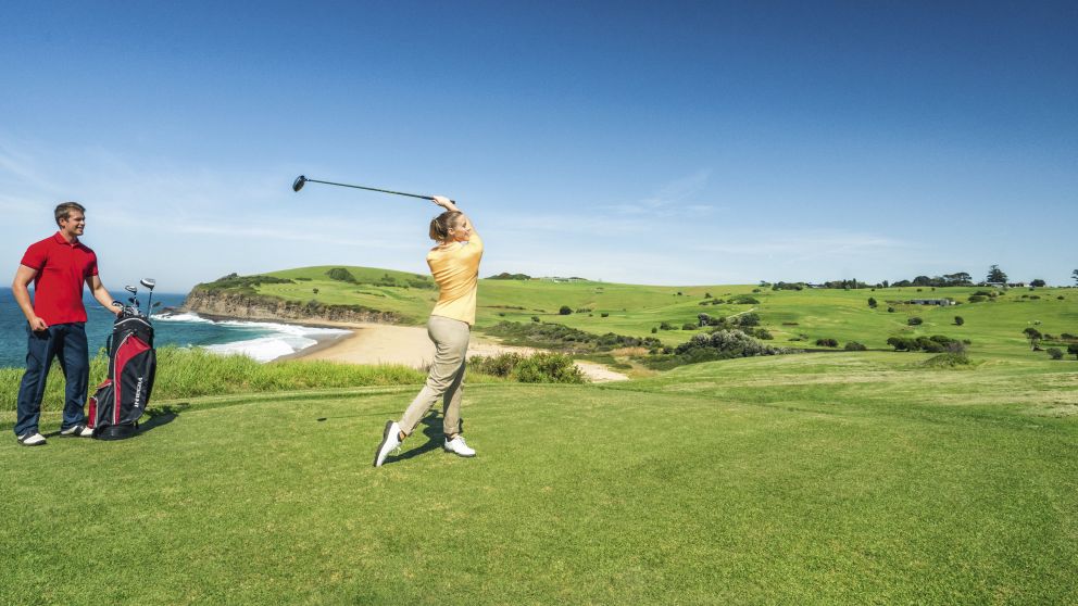 Couple enjoying a scenic round of golf at Kiama Golf Club on the South Coast