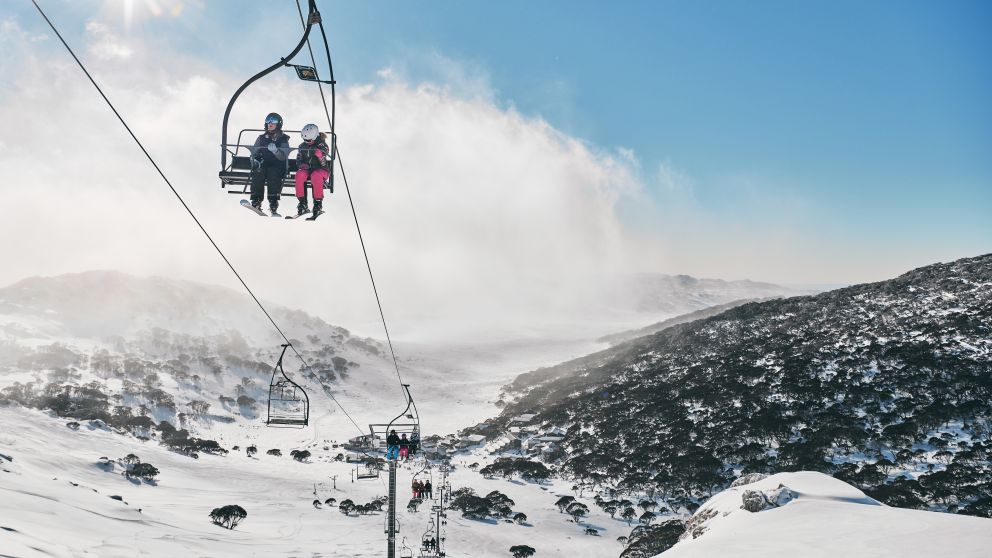 Skiers riding the chair lifts at Charlotte Pass Ski Resort in the Snowy Mountains