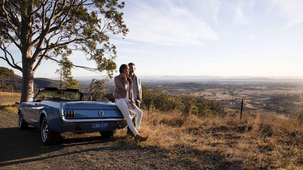 Couple enjoying views across Hunter Valley from Mount View Road, Pokolbin in the Hunter Valley