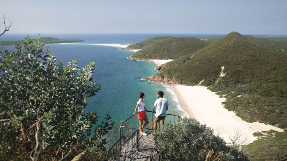 Couple enjoying the coastal views along Tomaree Head Summit Walk, Port Stephens