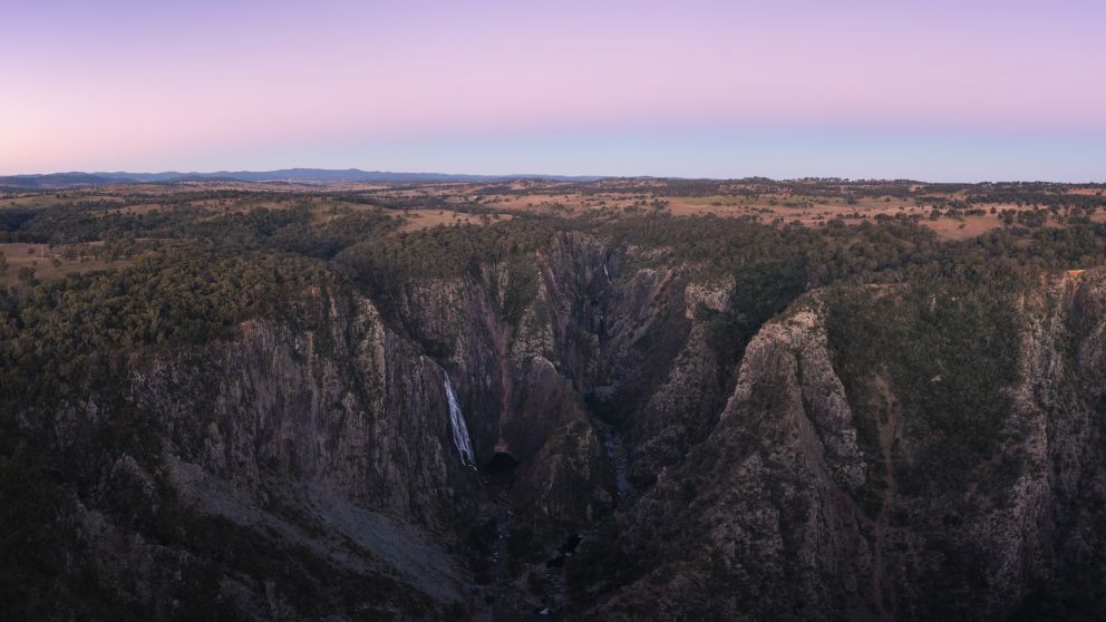 The sun setting over Wollomombi Falls in Oxley Wild Rivers National Park, Walcha