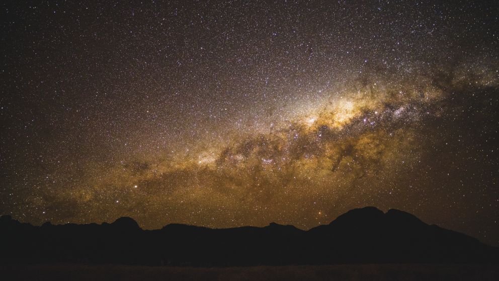 The starry Milky Way above the volcanic silhouette, Warrumbungles