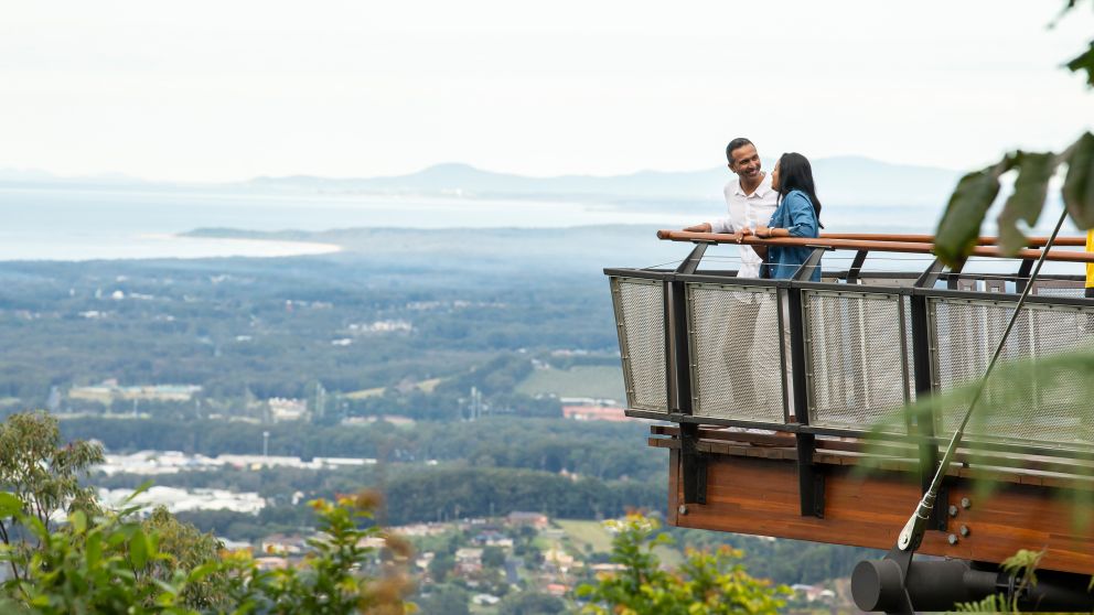 Couple enjoying scenic views over Coffs Harbour from Forest Sky Pier, Niigi Niigi - Sealy Lookout, Coffs Harbour