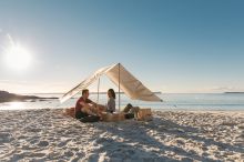 Couple enjoying a picnic, Hyams Beach Hampers, Blenheim Beach, Jervis Bay 