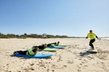 Women learning how to surf with Illawarra Surf Academy on Corrimal Beach near Wollongong 