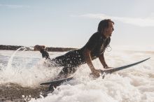 Man surfing at Turners Beach, Yamba, North Coast