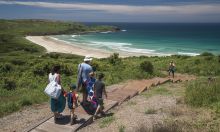 Family headed to the beach at Killalea State Park, "The Farm", Shellharbour 