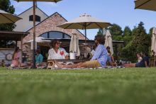 Couple on yard drinking gin, Husk Farm Distillery, North Tumbulgum - Credit: Cape Productions