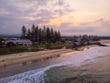 Sun setting over Main Beach in Byron Bay, North Coast