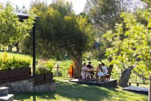 A family enjoys food and drink, Wildbrumby Distillery, Crackenback