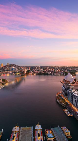 Sun rising over Sydney Harbour and Circular Quay, Sydney.