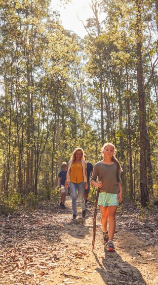 Family enjoying a walk through bushland in Mogo, Batemans Bay Area, South Coast