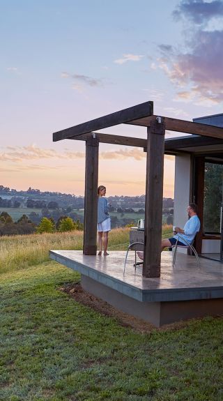 Couple enjoying the views in their country accommodation at Borrodell Vineyard in Canobolas, Orange Area in the Country NSW