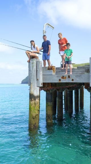 Family enjoying a day of fishing from the Lord Howe Island Wharf