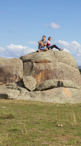 Couple enjoying a visit to the Australian Standing Stones in Glen Innes, Country NSW