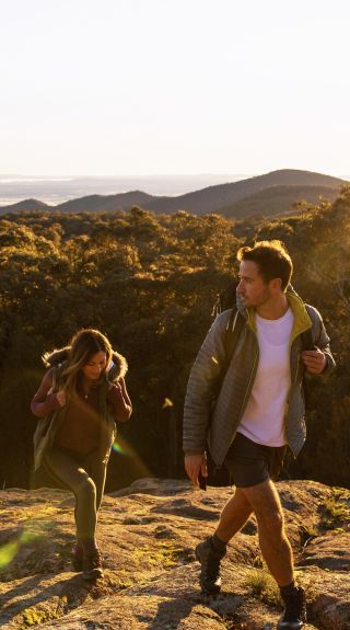 Couple enjoying a scenic walk through Woomargama National Park, Wantagong in Country NSW