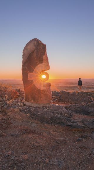 Man watching the sunseSunset over The Living Desert Reserve in Broken Hill, Outback NSWt from The Living Desert Reserve in Broken Hill, Outback NSW