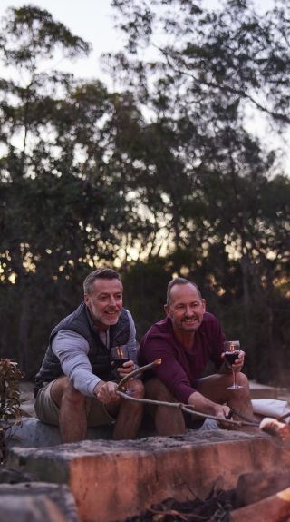 Couple enjoying a Wild Sleep Out camping experience at Walkabout Wildlife Sanctuary in Calga, Gosford Area, Central Coast