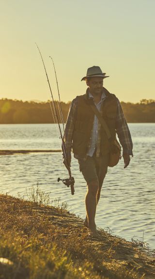 Man fishing in Tuross River in Tuross Heads, South Coast