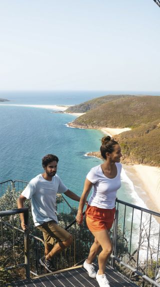 Couple enjoying the coastal views along Tomaree Head Summit Walk, Port Stephens