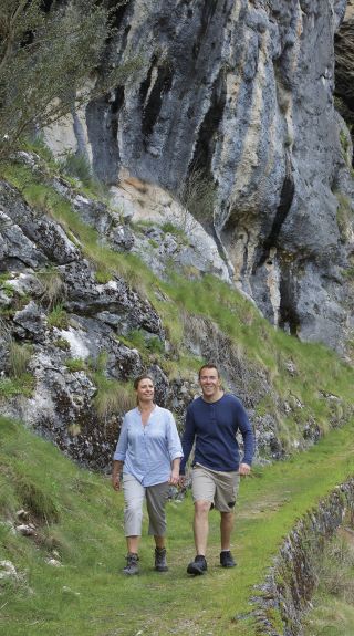 Couple enjoying a scenic bush walk by Yarrangobilly Caves in Kosciuszko National Park