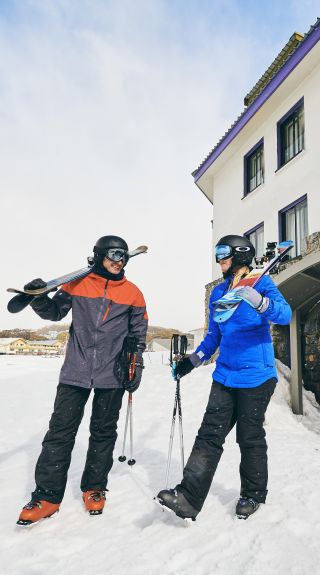 Couple setting out for a fun day of skiing at Perisher in the Snowy Mountains