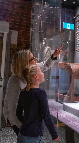 Mum and daughter looking at artifats. Old Dubbo Gaol, Dubbo