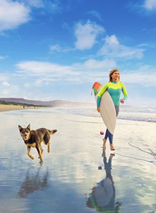 Surfer and Dog at Shoalhaven Heads