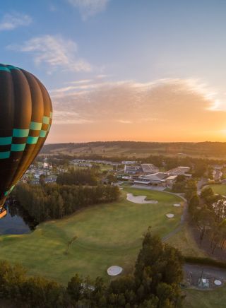 Hot air balloon over golf course in Lovedale, Hunter Valley