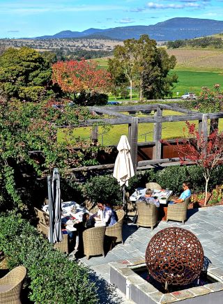 People enjoying local food and wine at Hollydene Estate Wines and Vines Restaurant in Singleton