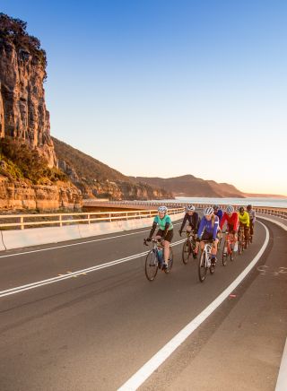 Group biking along Sea Cliff Bridge
