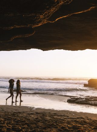 Friends enjoying a warm sunrise from Caves Beach, Lake Macquarie