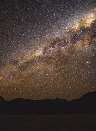 The starry Milky Way above the volcanic silhouette - Warrumbungles