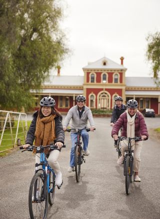 Cycling in front of the Dunera Museum in Hay