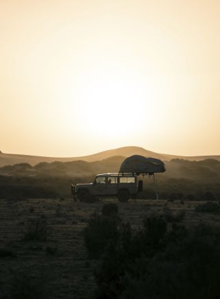 4WD setting up camp overlooking the sand dunes near Mungo National Park