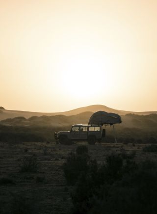4WD setting up camp overlooking the sand dunes near Mungo National Park