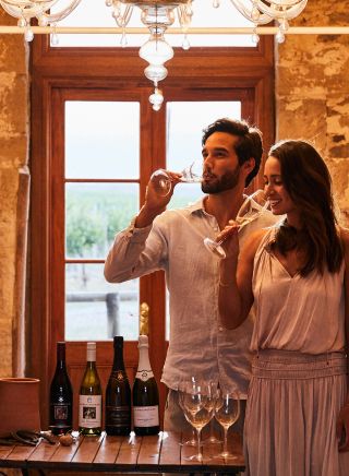 Couple enjoying a wine tasting experience at De Beaurepaire Wines, Rylstone