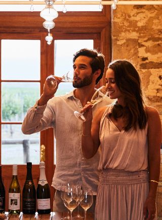 Couple enjoying a wine tasting experience at De Beaurepaire Wines, Rylstone