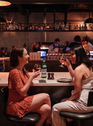 Friends enjoying food and drink at Parry Street Garage, Newcastle West